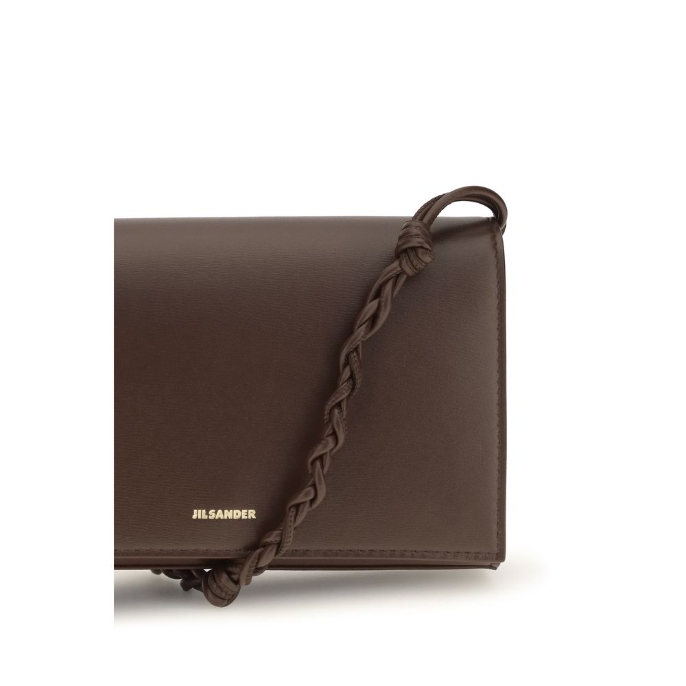 Jil Sander brown calf leather Bos Taurus wallet with sleek design and subtle branding, showcasing fine craftsmanship.