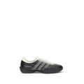 Y-3 black rubber athletic sneakers with sleek design and textured soles, perfect for sporty and casual wear.