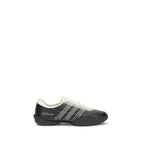 Y-3 black rubber athletic sneakers with sleek design and textured soles, perfect for sporty and casual wear.