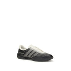 Y-3 black rubber athletic sneakers with sleek design and textured soles, perfect for sports and casual wear.