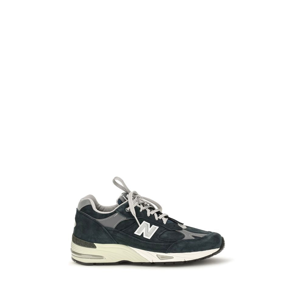 Blue suede leather athletic sneakers by New Balance, featuring a sleek design and comfortable fit.
