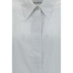 White modal shirt by Our Legacy, featuring a classic fit, button-down front, and soft fabric, displayed on a hanger.
