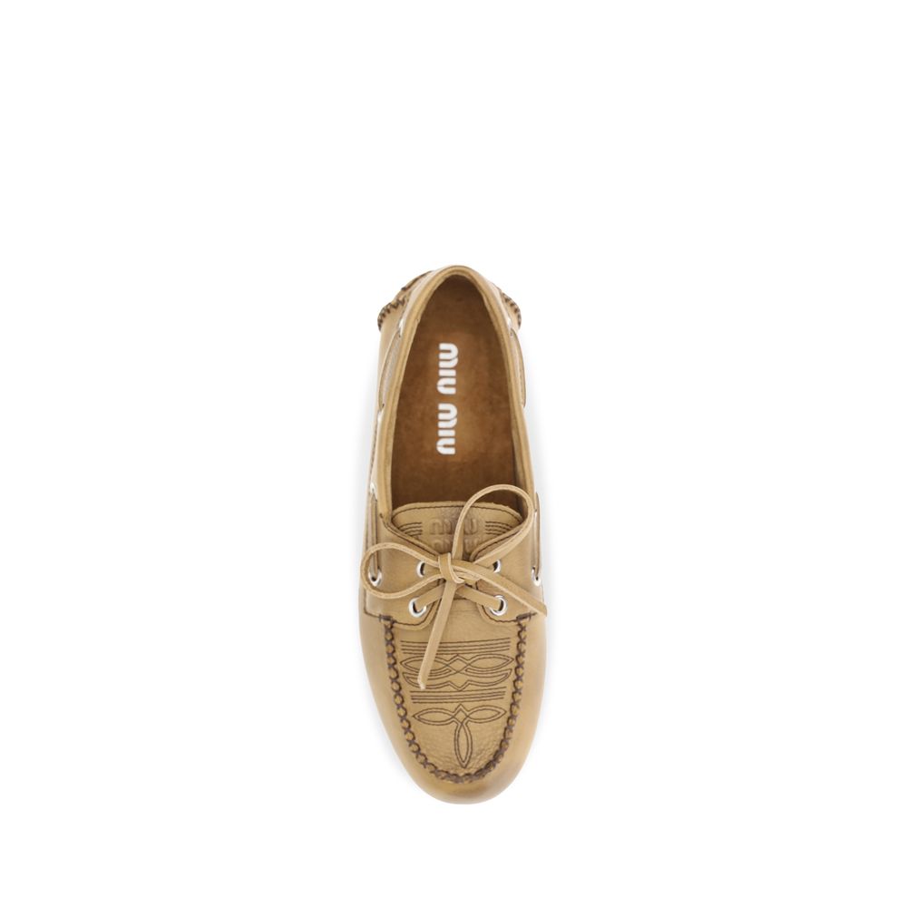 Miu Miu Beige Calf Leather Bos Taurus Slip-On Loafers - Eljoys Fashion 
