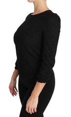 Black floral lace Dolce & Gabbana zipper top blouse with intricate lace details and a stylish fitted design.