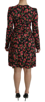 Black floral long-sleeve knee-length dress by Dolce & Gabbana featuring elegant design and intricate floral patterns.