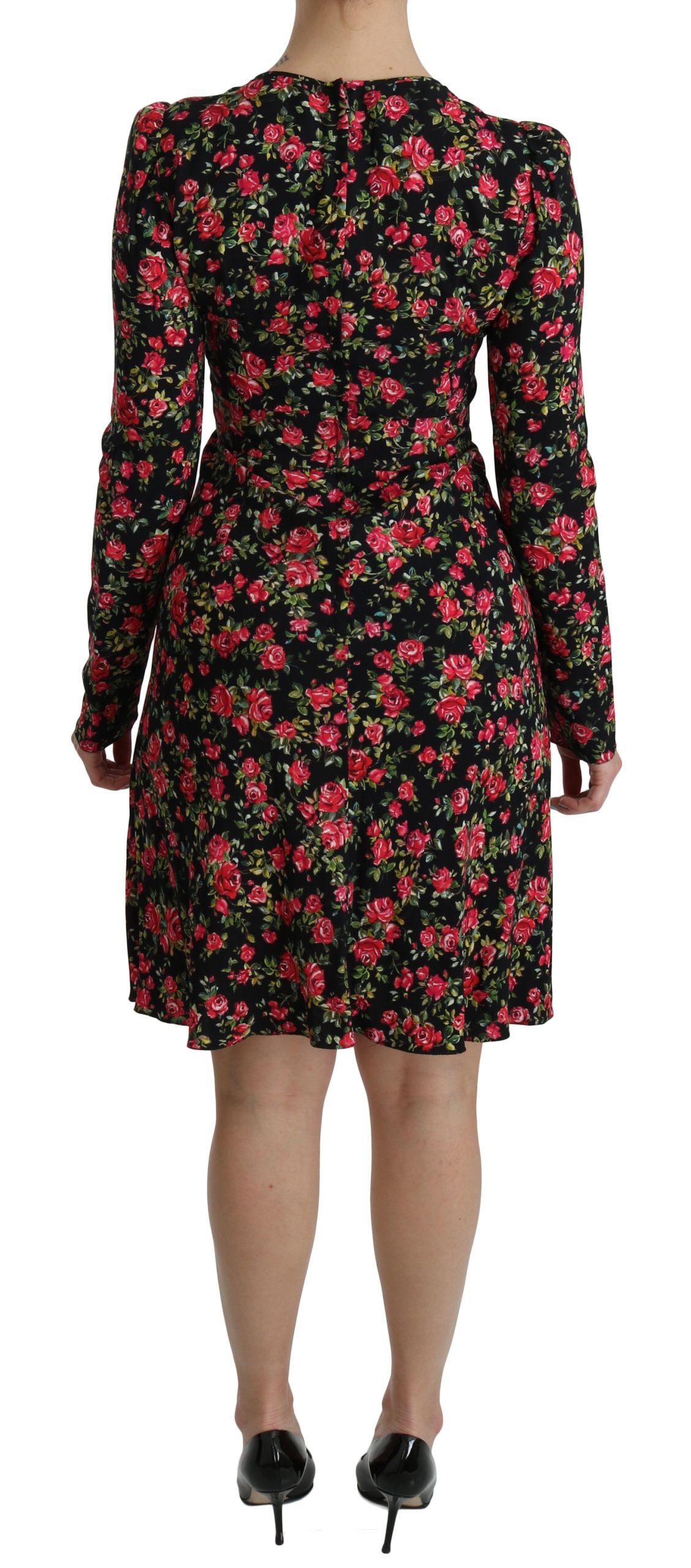 Black floral long-sleeve knee-length dress by Dolce & Gabbana featuring elegant design and intricate floral patterns.