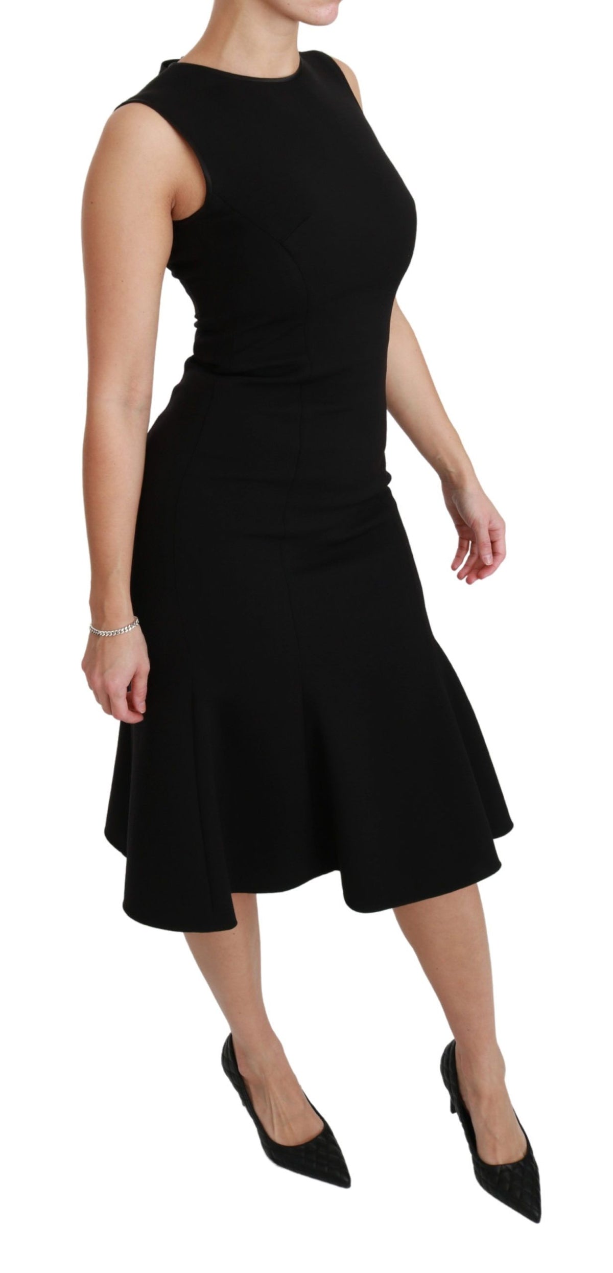 Dolce & Gabbana black fit and flare wool stretch sheath dress displayed on a model, showcasing elegant design and tailored fit.