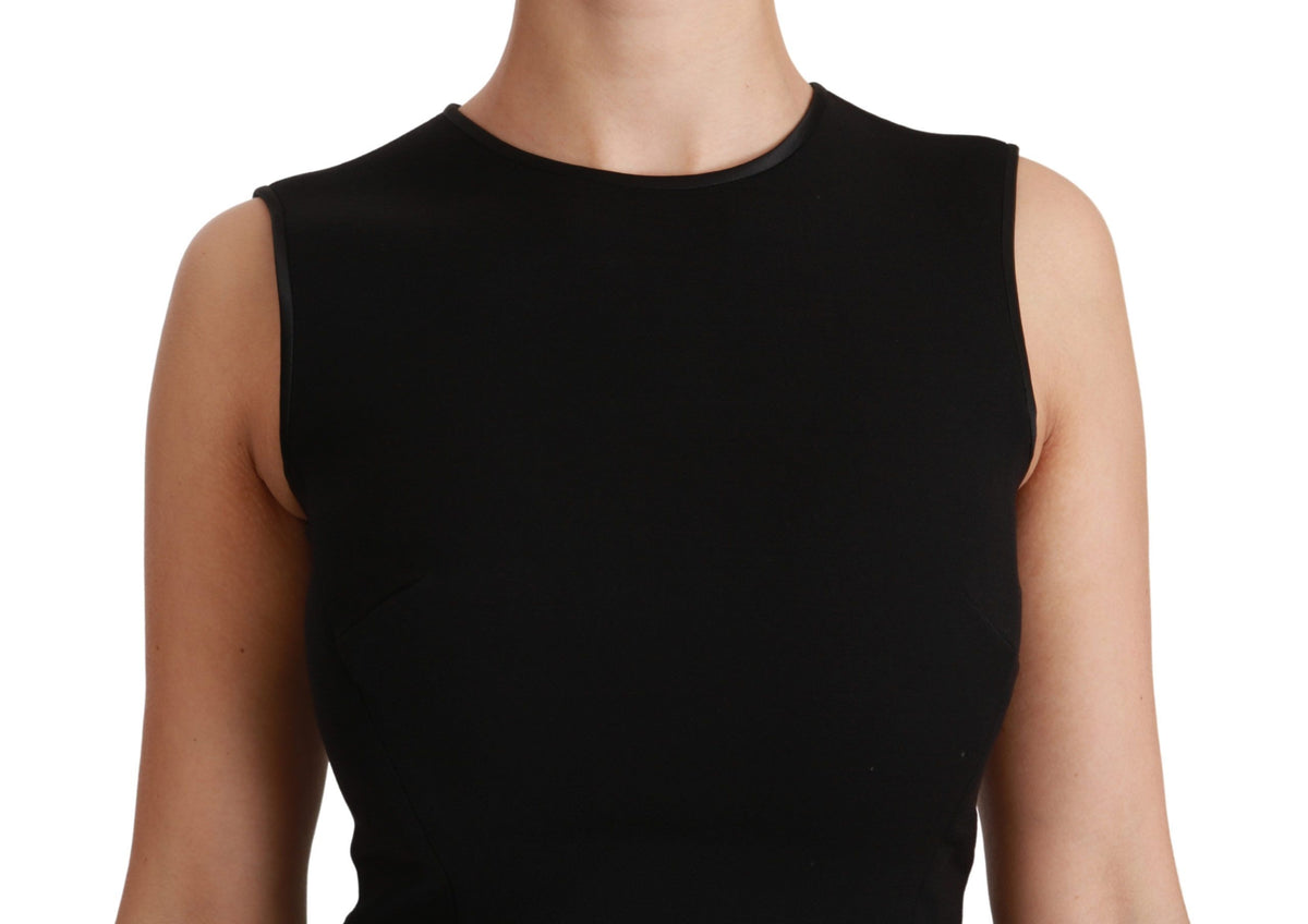 Black Dolce & Gabbana fit and flare wool stretch sheath dress displayed on a model, showcasing its elegant silhouette and design.