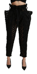 Dolce & Gabbana black floral lace tapered high waist pants with elegant design and fitted silhouette, suitable for stylish occasions.