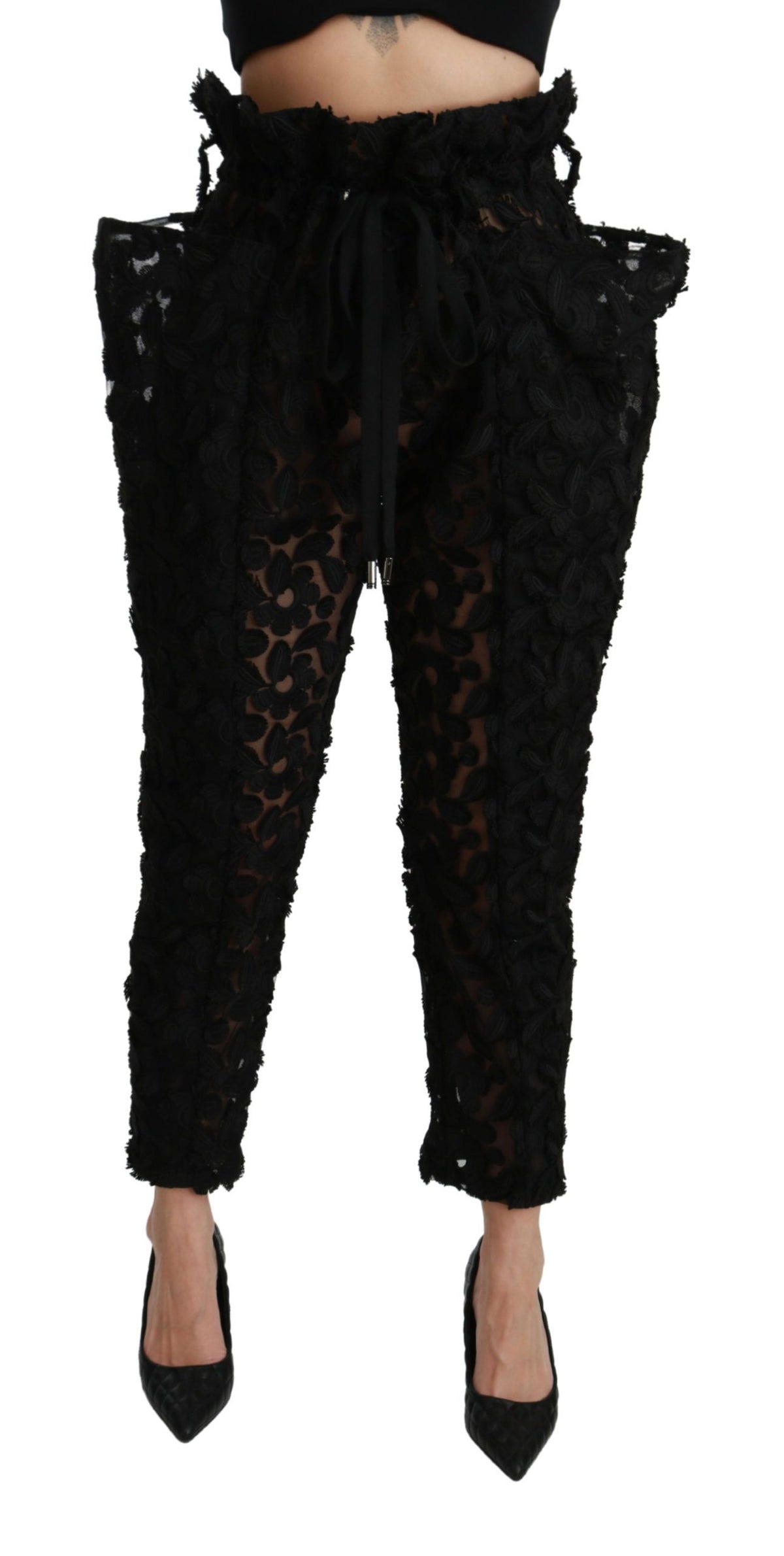 Dolce & Gabbana black floral lace tapered high waist pants with elegant design and fitted silhouette, suitable for stylish occasions.