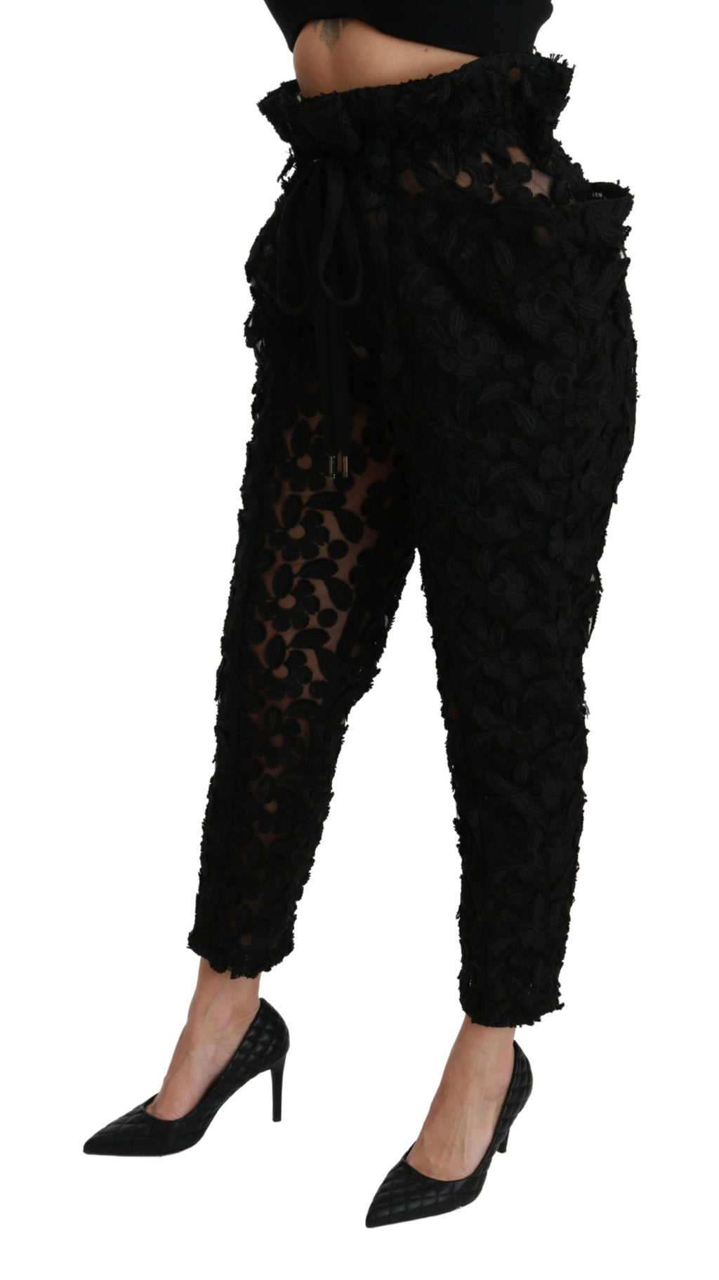 Black floral lace tapered high-waist pants by Dolce & Gabbana, featuring intricate lace detailing and a fitted high-rise silhouette.
