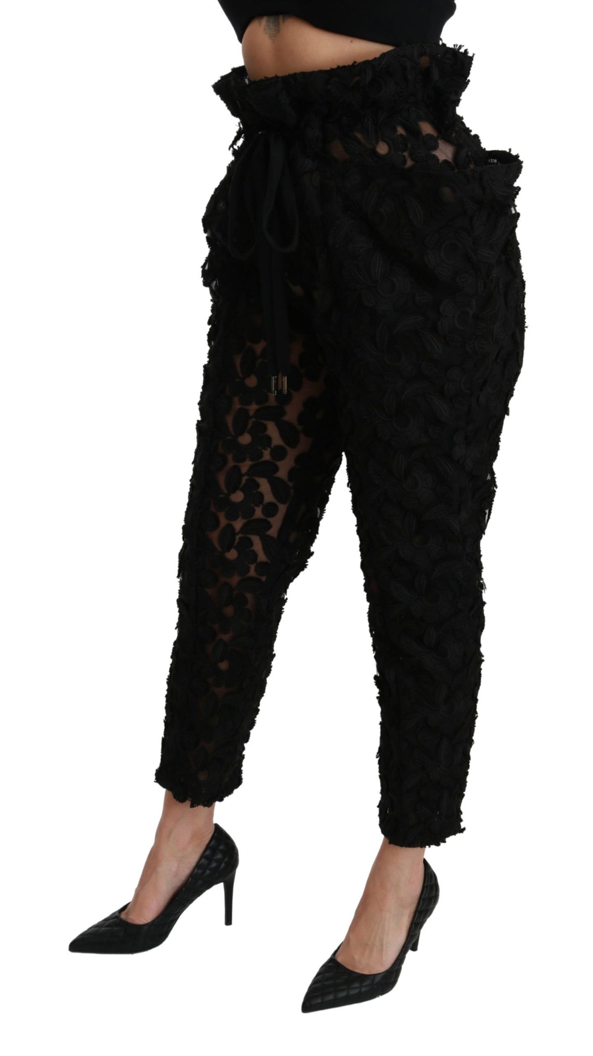 Black floral lace tapered high-waist pants by Dolce & Gabbana, featuring intricate lace detailing and a fitted high-rise silhouette.