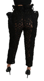 Dolce & Gabbana black floral lace tapered high waist pants with a fitted silhouette and intricate lace details.