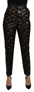 Dolce & Gabbana black and gold brocade high-waist pants with intricate pattern and tailored fit.