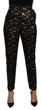Dolce & Gabbana black and gold brocade high-waist pants with intricate pattern and tailored fit.