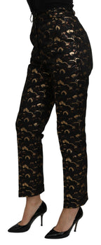 Dolce & Gabbana black and gold brocade high-waist pants with intricate floral pattern and tailored fit.