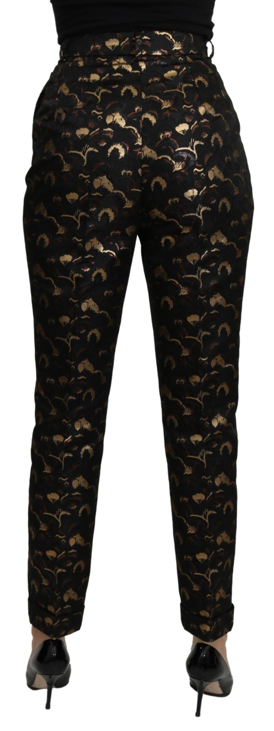 Dolce & Gabbana black and gold brocade high waist pants displayed on a hanger.