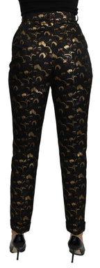 Dolce & Gabbana black and gold brocade high waist pants displayed on a hanger.