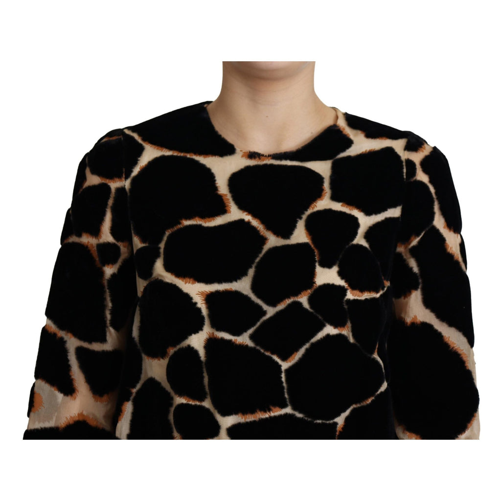 Dolce & Gabbana black giraffe print shift mini dress displayed on a mannequin.