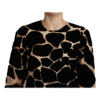 Dolce & Gabbana black giraffe print shift mini dress displayed on a mannequin.