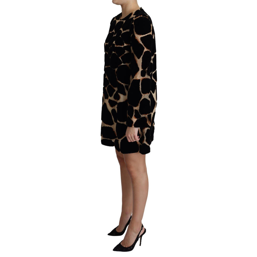 Dolce & Gabbana black giraffe print shift mini dress with short sleeves and fitted silhouette.