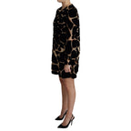 Dolce & Gabbana black giraffe print shift mini dress with short sleeves and fitted silhouette.