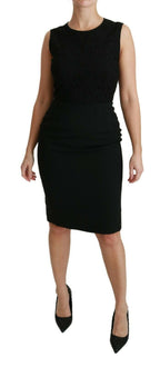 Black floral lace Dolce & Gabbana sheath gown dress with intricate lace details and a fitted silhouette.