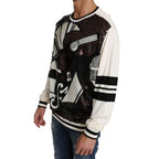 Dolce & Gabbana white jazz sequined guitar pullover sweater with long sleeves and a round neckline.