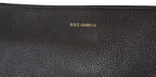 Dolce & Gabbana black exotic leather shoulder sling bag with gold hardware and textured design.