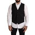 Black formal dress vest by Dolce & Gabbana, tailored fit with sleek fabric and elegant design, displayed on a mannequin.