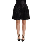 Dolce & Gabbana black floral brocade high-waist mini shorts with intricate floral pattern and tailored fit.
