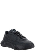 Valentino Garavani black calf leather sneakers with sleek design and logo accents, stylish and comfortable footwear for casual wear.
