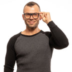 Yohji Yamamoto black plastic eyeglass frames with a sleek, modern design, shown in a close-up image.