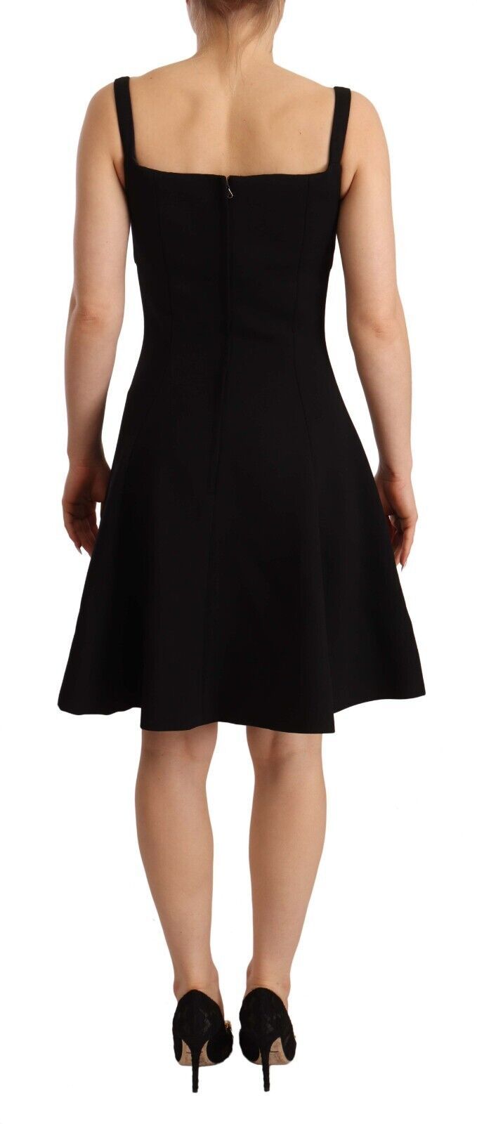 Black Dolce & Gabbana fit flare wool stretch sheath dress displayed on a mannequin, showcasing elegant design and tailored fit.