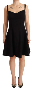 Black Dolce & Gabbana fit and flare wool stretch sheath dress displayed on a hanger with a smooth fabric texture.