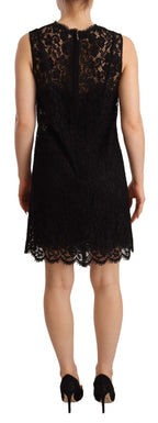 Dolce & Gabbana black floral lace sheath sleeveless mini dress shown on model, detailed lace fabric and fitted silhouette.