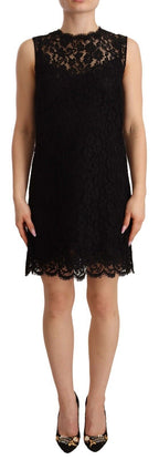 Dolce & Gabbana black floral lace sleeveless sheath mini dress displayed on a hanger, showcasing intricate lace details and fitted silhouette.