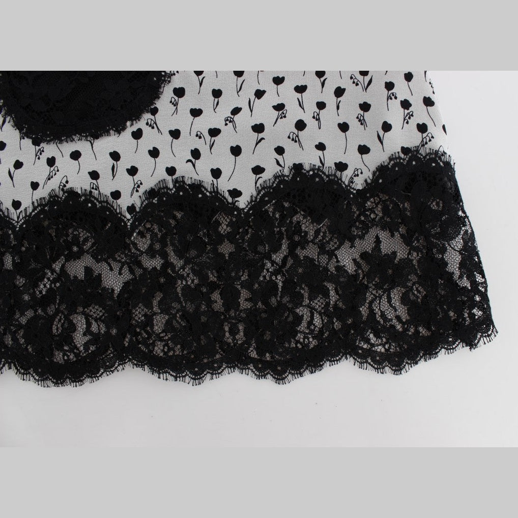Black silk lace babydoll lingerie top by Dolce & Gabbana with intricate lace details and delicate satin ribbons.