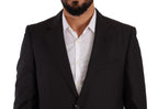 Dark gray Domenico Tagliente single-breasted formal suit displayed on a mannequin, featuring a tailored fit and classic lapels.