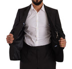 Dark gray Domenico Tagliente single-breasted formal suit, tailored fit with notch lapel and matching trousers, displayed on a hanger.