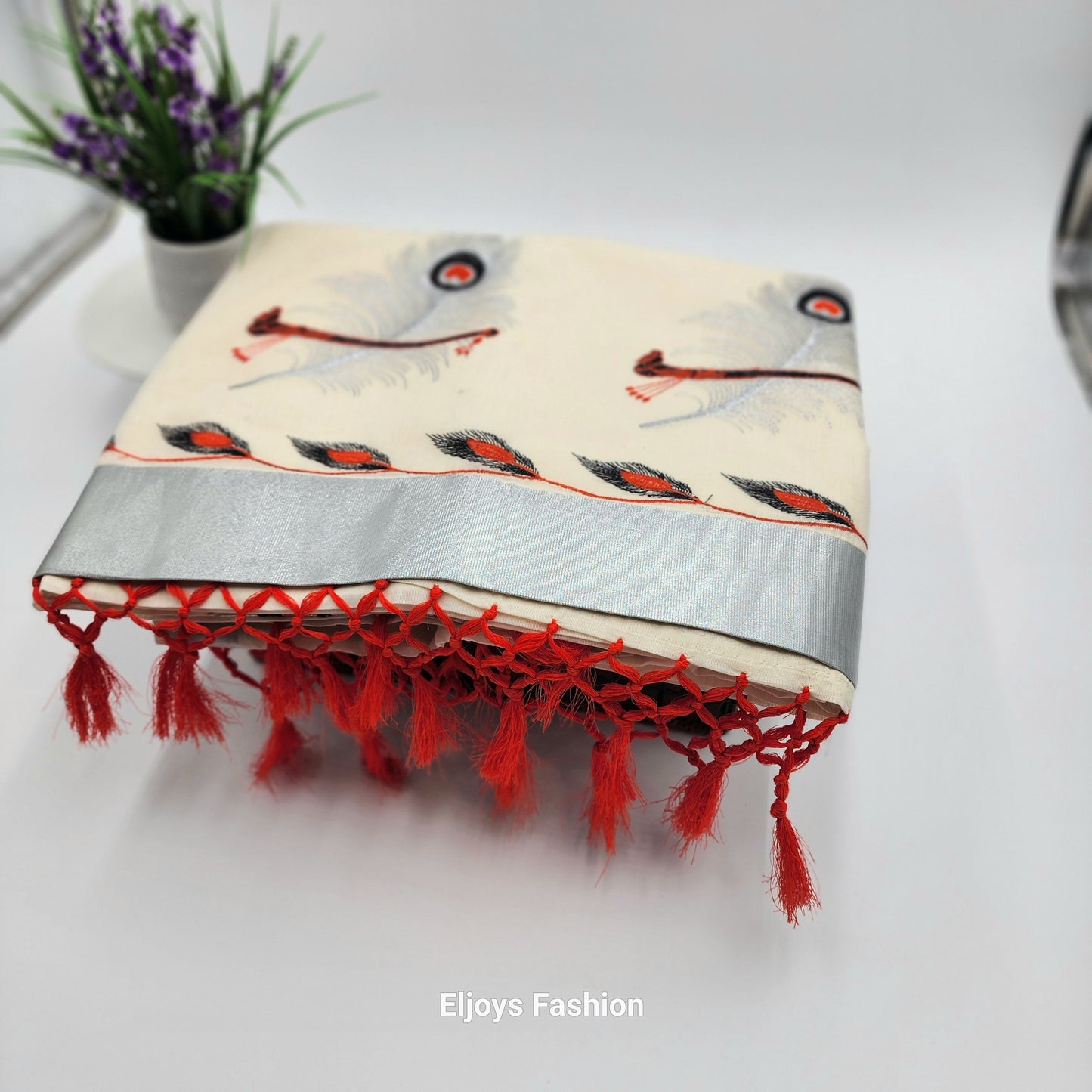 Tissue Silk Saree in beautiful peacock and covert design  in Red, black and silver color Combination