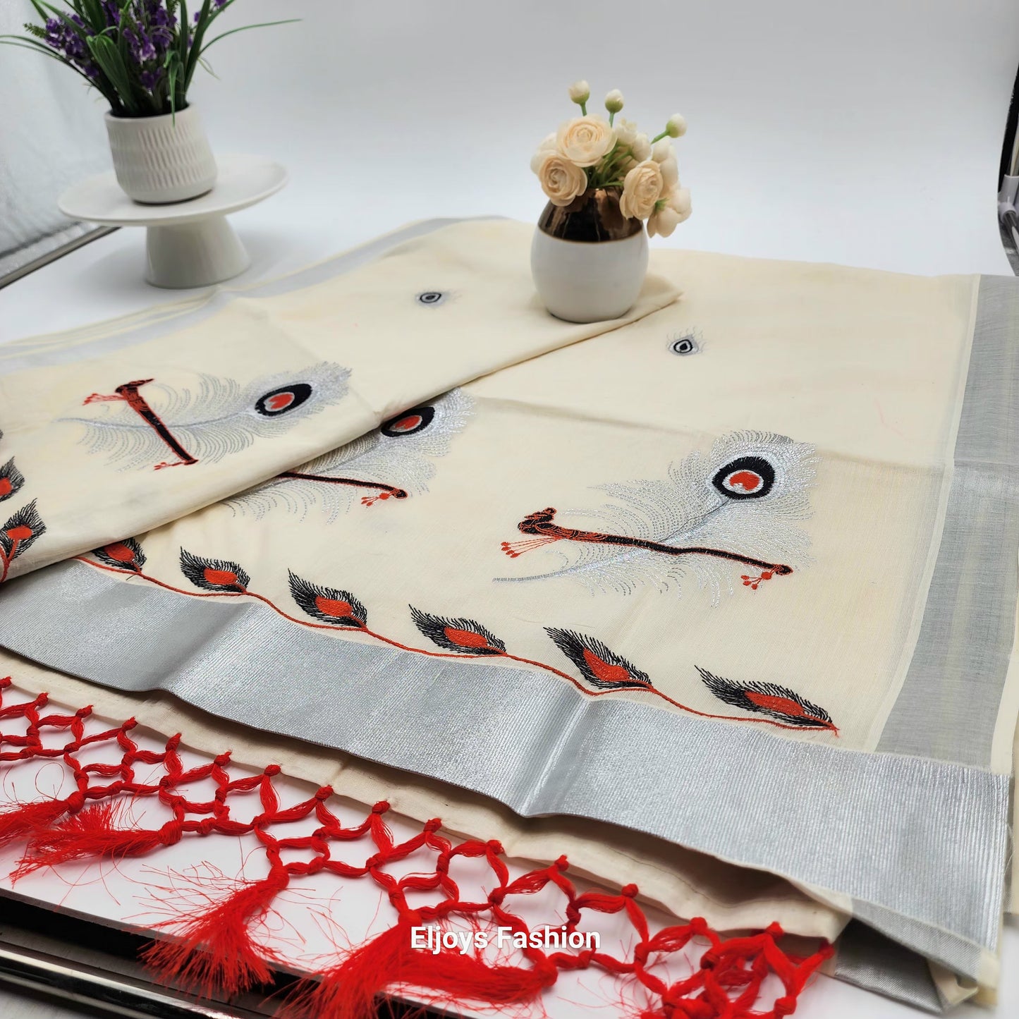 Tissue Silk Saree in beautiful peacock and covert design  in Red, black and silver color Combination