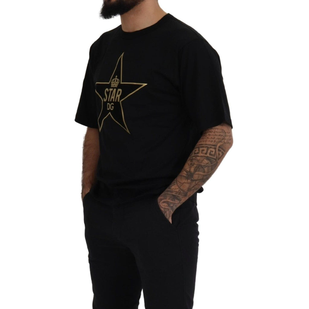 Dolce & Gabbana black cotton crewneck T-shirt with gold star crown graphic and DG branding on front.
