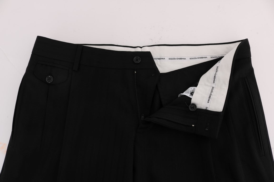 Dolce & Gabbana black striped wool stretch pants, tailored fit with subtle pattern, front view showing waistband and leg details.