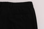 Dolce & Gabbana black wool stretch pants with white vertical stripes, tailored fit, and classic design.