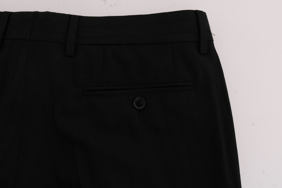 Dolce & Gabbana black wool stretch pants with white vertical stripes, tailored fit, and classic design.