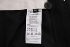 Dolce & Gabbana black wool stretch pants with bold striped pattern, tailored fit, and classic design for sophisticated style.