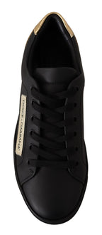 Dolce & Gabbana black leather low top sneakers for women with gold accents, stylish and comfortable footwear.