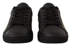 Dolce & Gabbana black leather low top sneakers for women with gold accents, stylish and comfortable footwear.