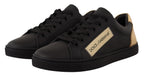 Dolce & Gabbana black leather low top sneakers for women with gold accents and stylish design.